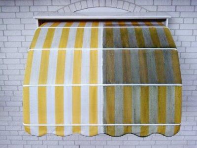 Schoonmaken zonneschermdoek reinigen markiezen met groene aanslag